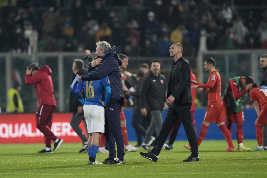 North Macedonia players celebrate as Italy&#039;s Alessandro Bastoni removes his shirt after his team&#039;s got eliminated at the end of the World Cup qualifying play-off soccer match between Italy a ...