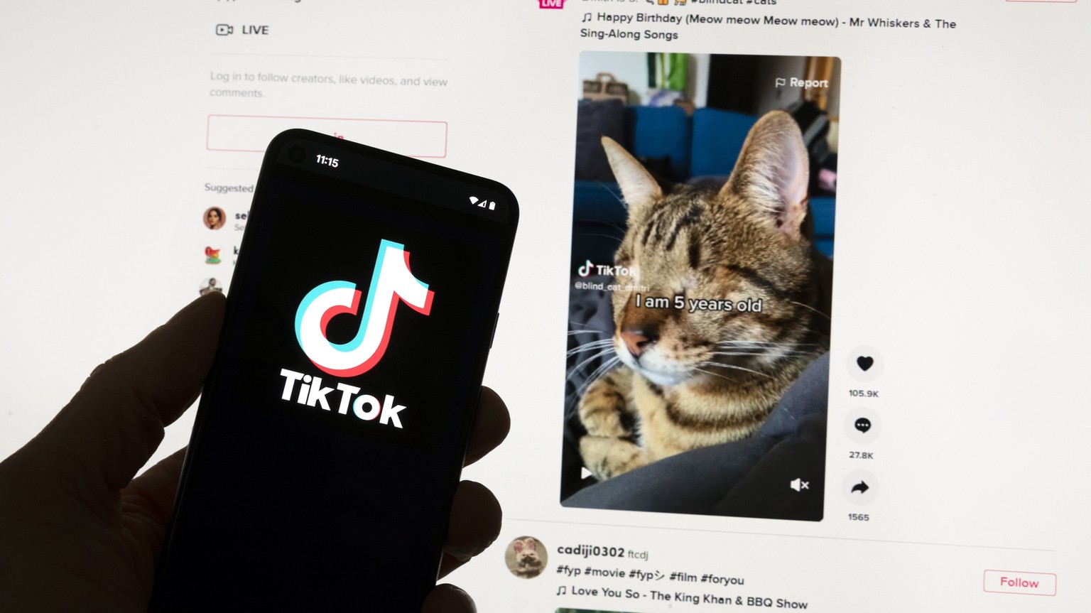 FILE - The TikTok logo is seen on a cell phone in front of a computer screen displaying the TikTok home screen, Saturday, March 18, 2023, in Boston.  European Union regulators have stepped up scrutiny...