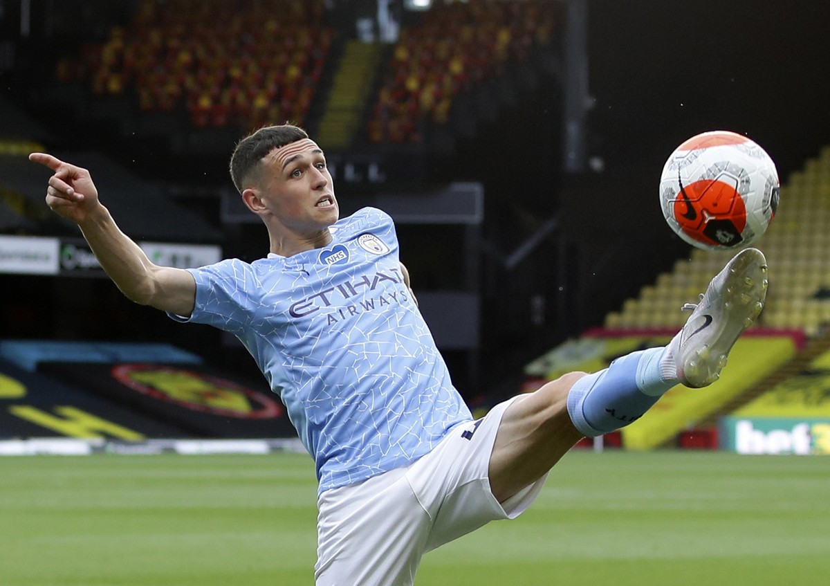 FILE - In this Tuesday, July 21, 2020 file photo, Manchester City's Phil Foden kicks the ball during the English Premier League soccer match between Watford and Manchester City at the Vicarage Ro ...