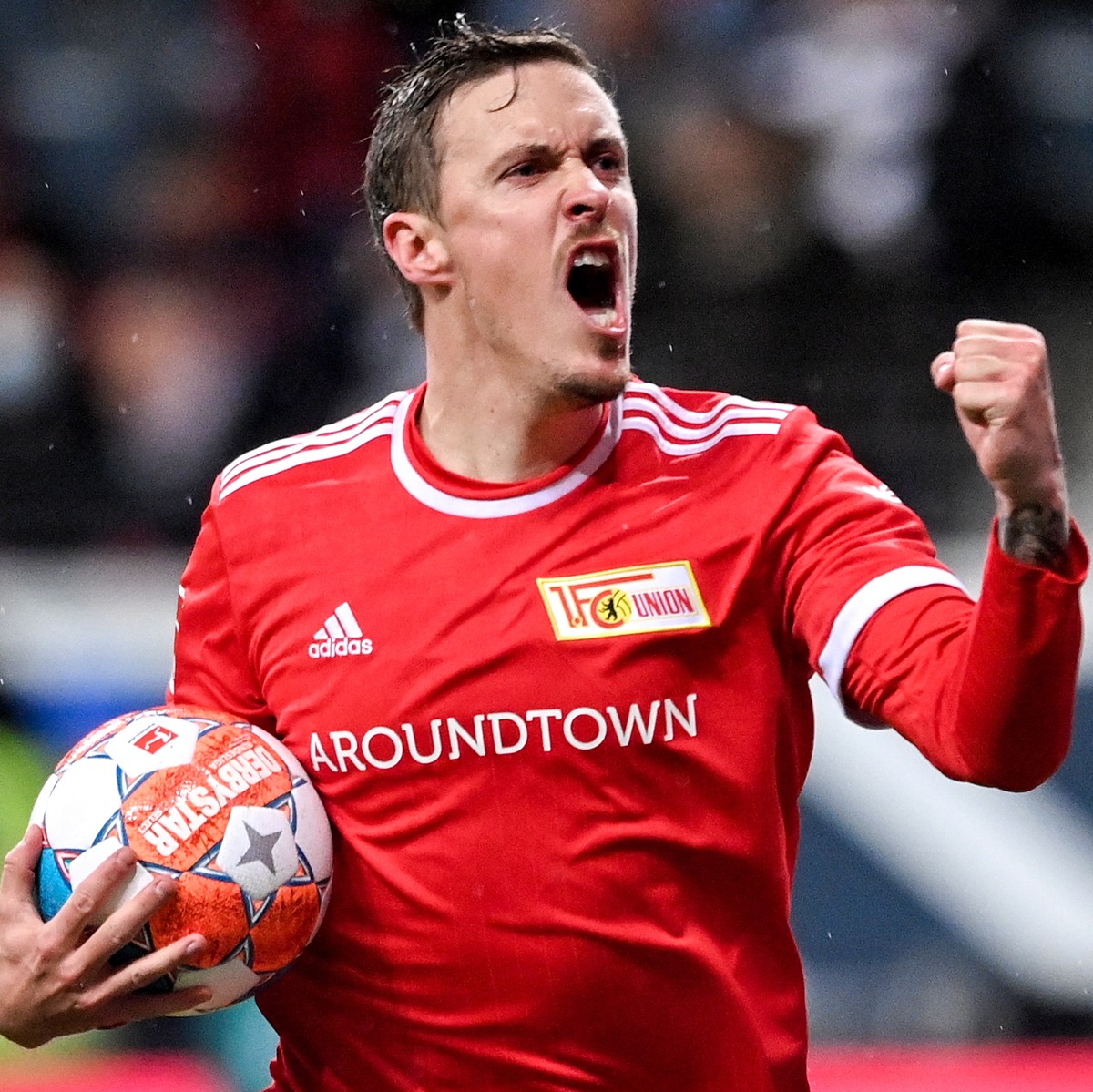 epa09609276 Union's Max Kruse celebrates after scoring the 1-1 equalizer from the penalty spot during the German Bundesliga soccer match between Eintracht Frankfurt and FC Union Berlin in Frankfu ...