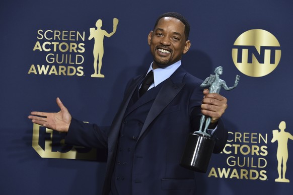 Will Smith, winner of the award for outstanding performance by a male actor in a leading role for &quot;King Richard,&quot; poses in the press room at the 28th annual Screen Actors Guild Awards at the ...