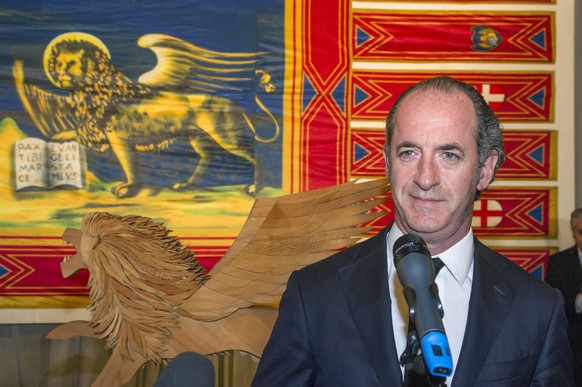 Veneto Region President Luca Zaia listens to a journalist&#039;s question at the Balbi Palace regional council, in Venice, northern Italy, Monday, Oct. 23, 2017, a day after twin referendums seeking m ...