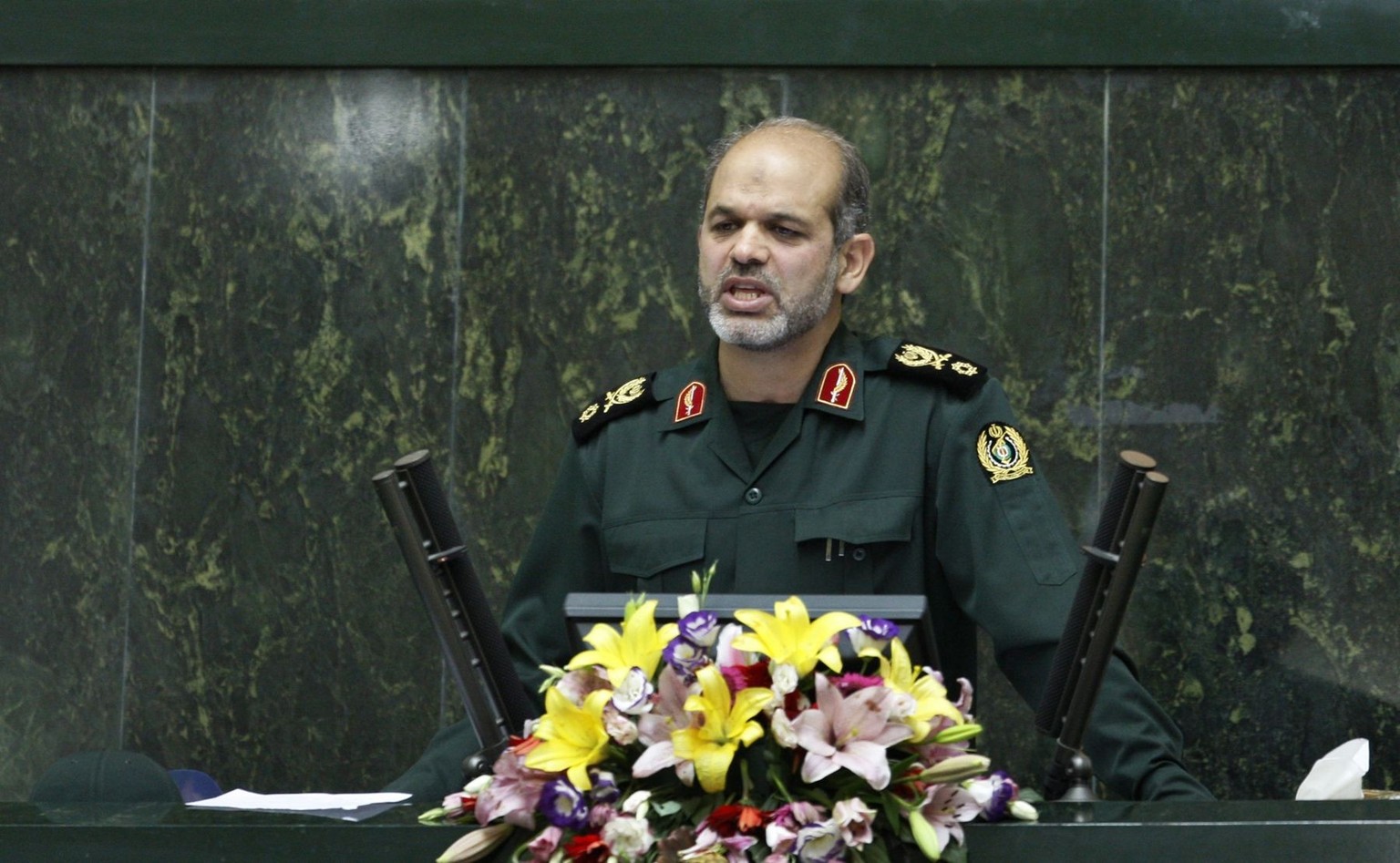Nominee for defense minister, Gen. Ahmad Vahidi, delivers his speech in an open session of parliament to debate on the qualification of proposed ministers of Iranian President Mahmoud Ahmadinejad, in  ...