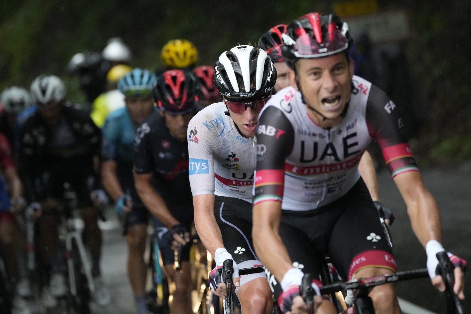 Italy&#039;s Davide Formolo, right, sets the pace for his leader Slovenia&#039;s Tadej Pogacar, in second position, during the eighth stage of the Tour de France cycling race over 150.8 kilometers (93 ...