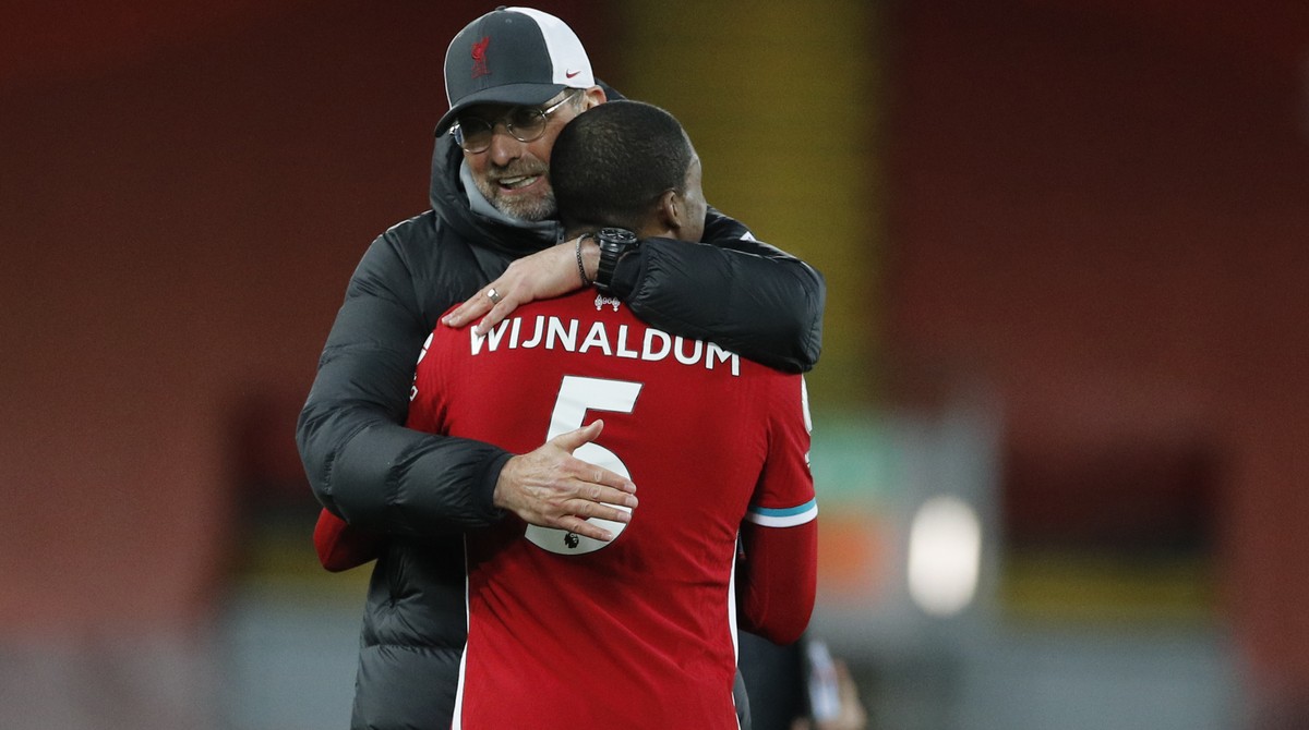 Liverpool's manager Jurgen Klopp celebrates with Liverpool's Georginio Wijnaldum at the end of the English Premier League soccer match between Liverpool and Southampton at Anfield stadium in ...