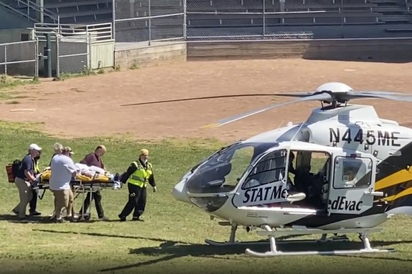 In this still image from video, author Salman Rushdie is taken on a stretcher to a helicopter for transport to a hospital after he was attacked during a lecture at the Chautauqua Institution in Chauta ...