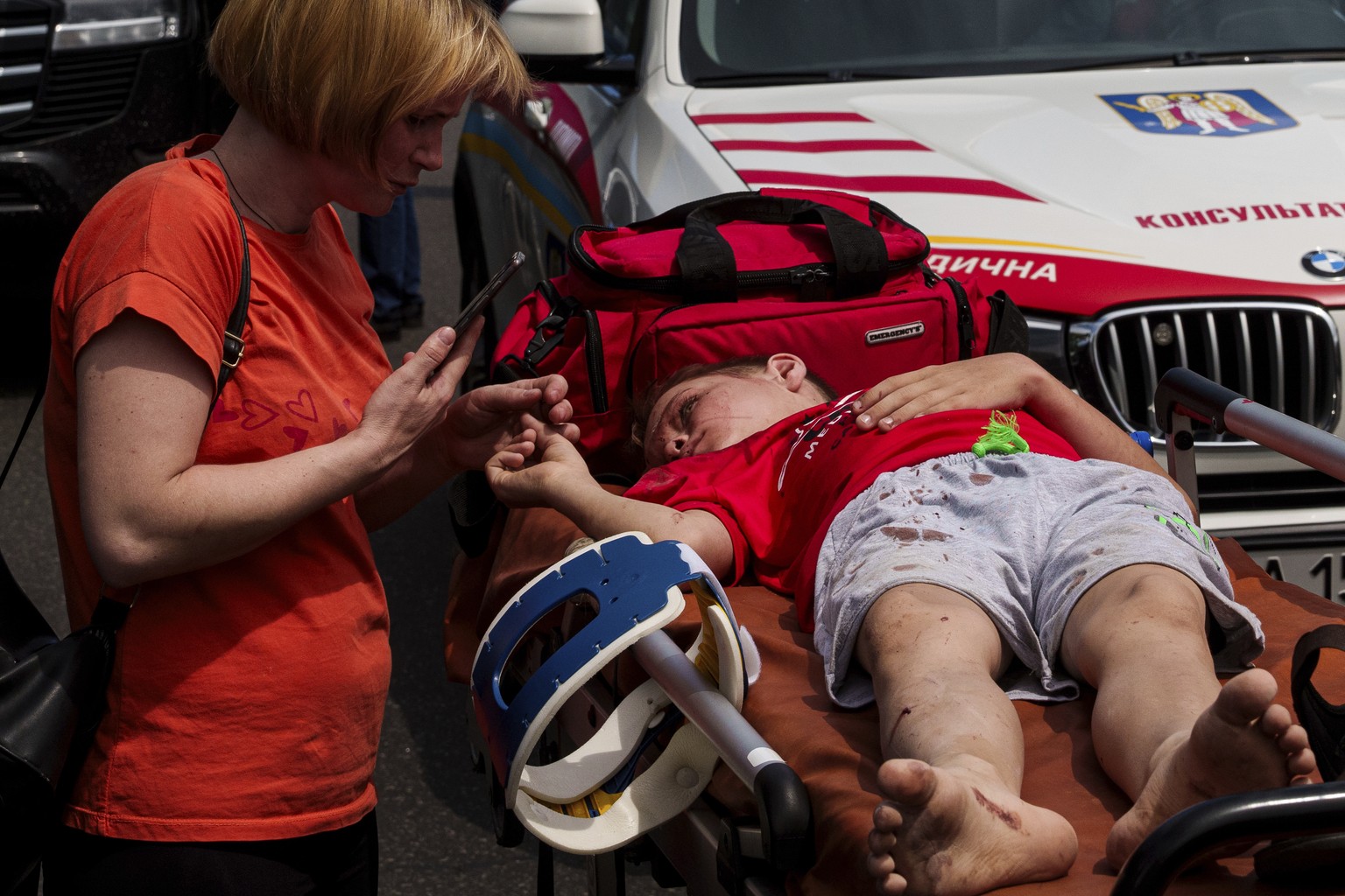 A rescuer tends to a youth at the site of Okhmatdyt children?s hospital hit by Russian missiles, in Kyiv, Ukraine, Monday, July 8, 2024. Russian missiles have killed multiple people and struck a child ...