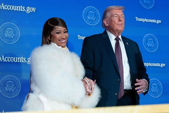 President Donald Trump greets Nicki Minaj on stage during the launch of a program known as Trump Accounts at the Andrew W. Mellon Auditorium, Wednesday, Jan. 28, 2026, in Washington.
Donald Trump