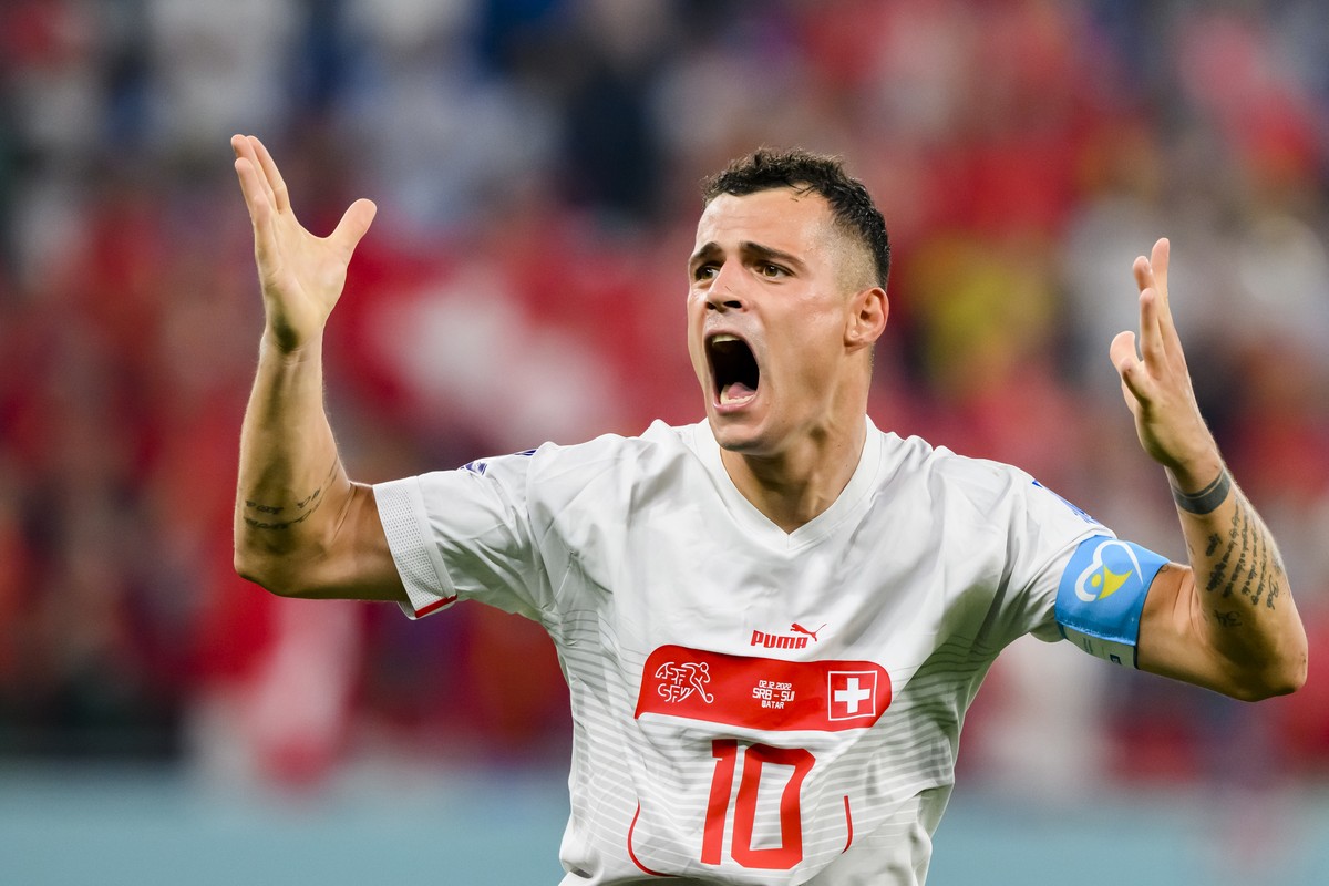 Switzerland's midfielder Granit Xhaka celebrates the third goal scoring by Switzerland's midfielder Remo Freuler during the FIFA World Cup Qatar 2022 group G soccer match between Serbia and  ...