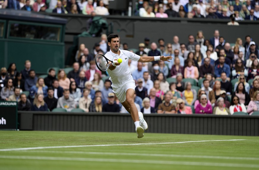 Serbia&#039;s Novak Djokovic plays a return to South Africa&#039;s Kevin Anderson during the men&#039;s singles second round match on day three of the Wimbledon Tennis Championships in London, Wednesd ...