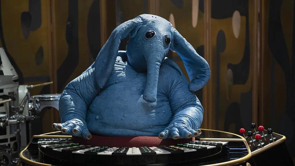 Max Rebo (the blue elephant guy): he's an Ortolan and musician in his band the Max Rebo Band. The music genre, he most frequently plays, is called jizz (yes, that's how Lucas named the style ...