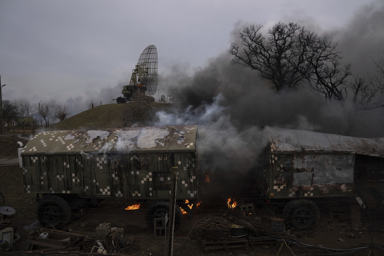 Smoke rise from an air defence base in the aftermath of an apparent Russian strike in Mariupol, Ukraine, Thursday, Feb. 24, 2022. Russian troops have launched their anticipated attack on Ukraine. Big  ...