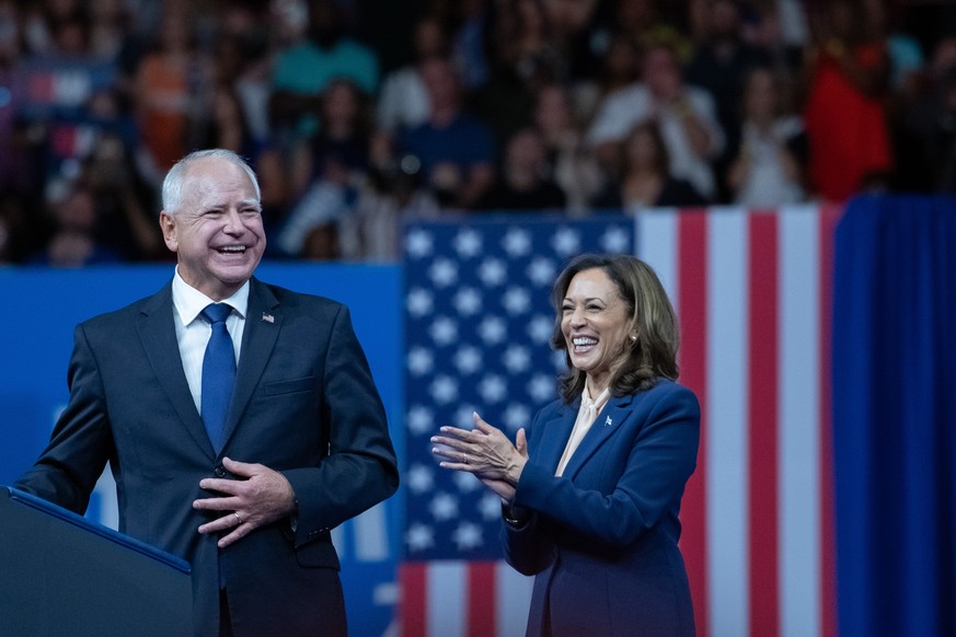 epa11532156 Democratic presidential candidate US Vice President Kamala Harris (R) holds a campaign rally with her new running mate Democratic vice presidential candidate Minnesota Governor Tim Walz (L ...