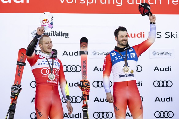 Second placed Marco Odermatt of Switzerland, left, and winner Loic Meillard of Switzerland, right, celebrate during the podium ceremony of the men's Giant Slalom race at the FIS Alpine Ski World  ...