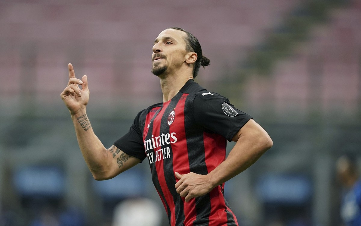 AC MilanâÄ™s Zlatan Ibrahimovic celebrates after scoring scores his sideâÄ™s first goal during the Serie A soccer match between Inter Milan and AC Milan at the San Siro Stadium, in Milan, Italy, Satur ...