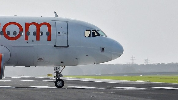 epa05297689 (FILE) A file photo dated 23 October 2015 showing an Airbus A319 of Easyjet crossing the redeveloped northern runway as it taxies to the start on the southern runway of the airfield at Sch ...