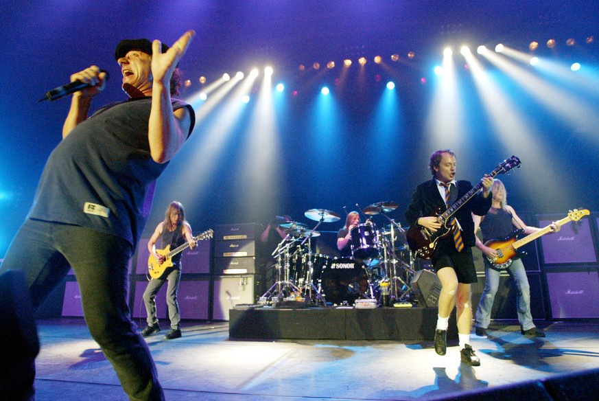 FILE - This June 17, 2003 file photo shows British rock band AC/DC, from left, Brian Johnson, Malcolm Young, Phil Rudd, Angus Young, and Cliff Williams performing on stage during a concert in Munich,  ...