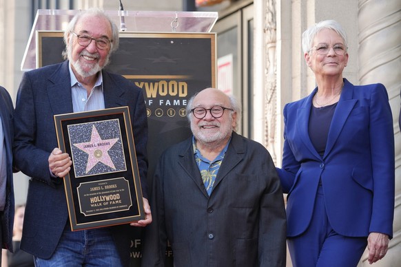 James L. Brooks, from left, Danny DeVito, and Jamie Lee Curtis pose with Brooks&#039; new star during a ceremony on the Hollywood Walk of Fame on Thursday, Dec. 11, 2025, in Los Angeles. (AP Photo/Chr ...