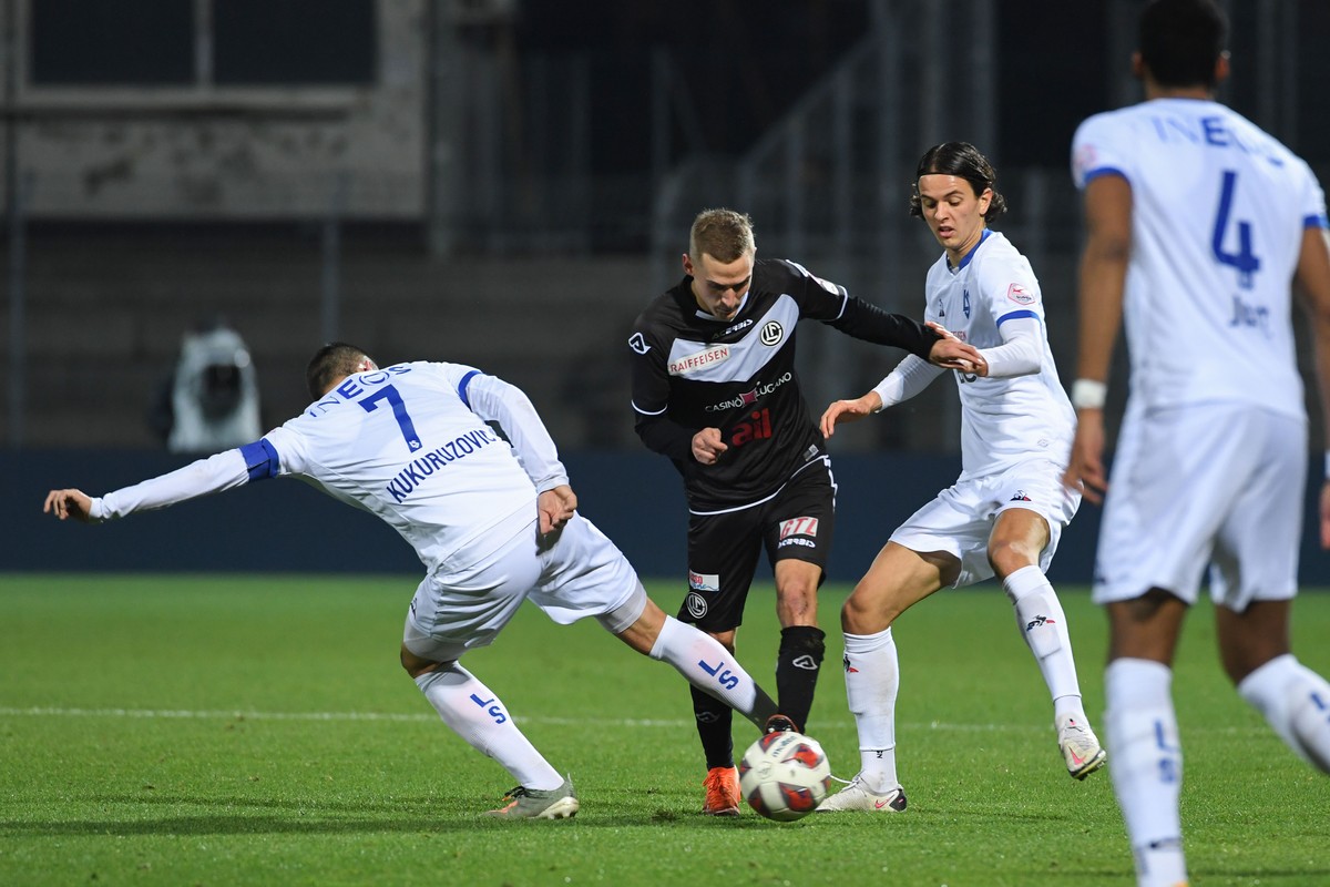 From left, Lausanne's player Stjpan Kukuruzovic and Lugano's player Mattia Bottani, during the Super League soccer match FC Lugano against FC Lausanne Sport, at the Cornaredo stadium in Luga ...