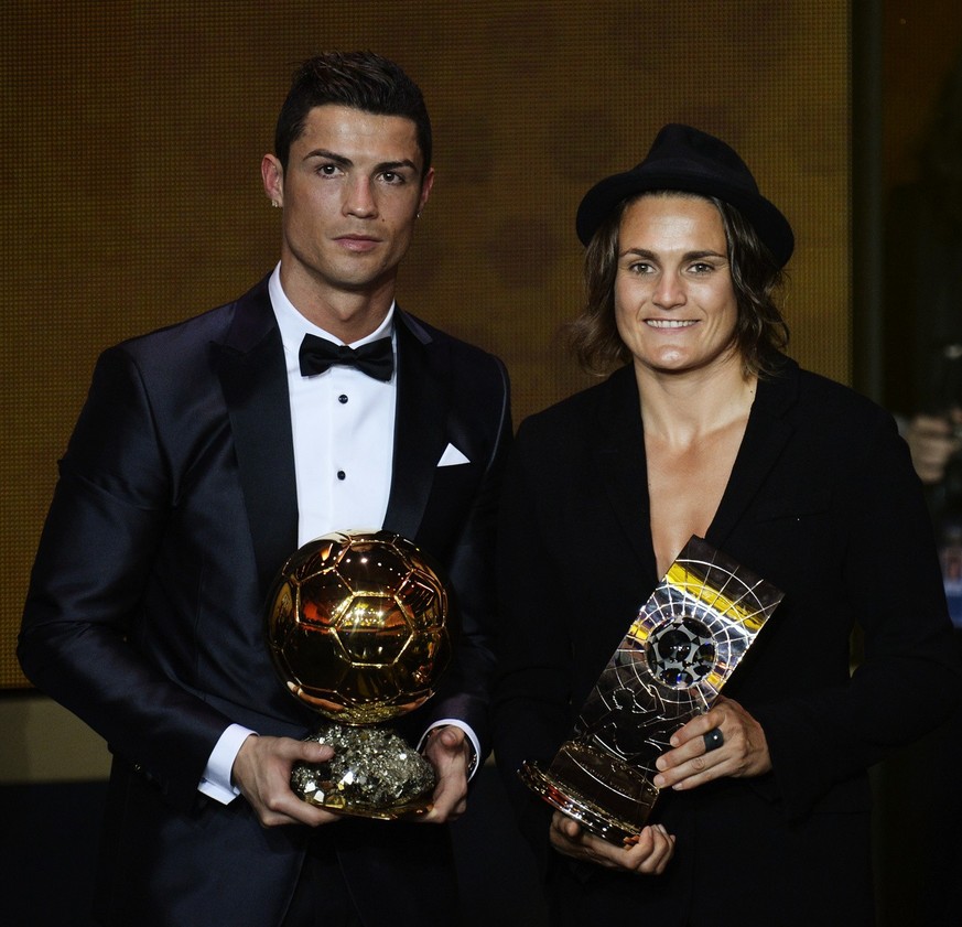 Cristiano Ronaldo of Portugal, left, and Nadine Angerer of Germany, left, pose with their trophies after being elected FIFA Men&#039;s and Women&#039;s soccer player of the year 2013 at the FIFA Ballo ...