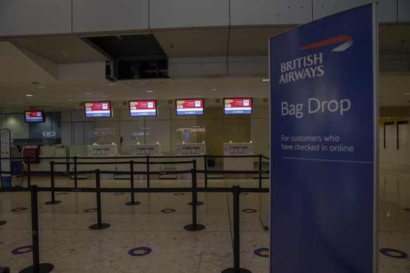 The desk of British Airway is closed after Switzerland cancelled all flights between Switzerland and Great Britain at the Geneva Airport, in Geneva, Switzerland, Monday, December 21, 2020. Switzerland ...