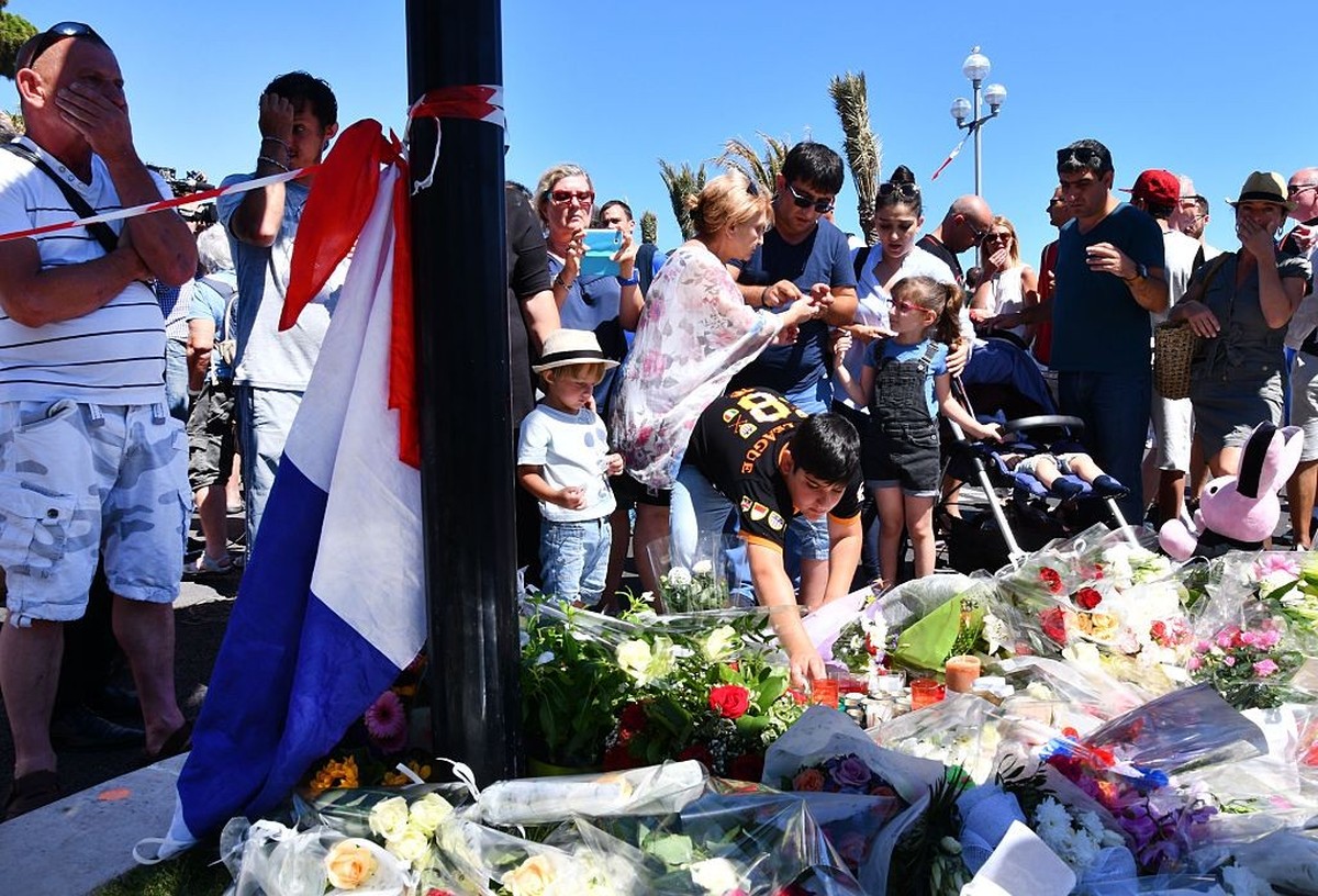 NICE, FRANCE - JULY 15 : People visit the scene and lay tributes to the victims of a terror attack on the Promenade des Anglais on July 15, 2016 in Nice, France. A French-Tunisian attacker killed 84 p ...