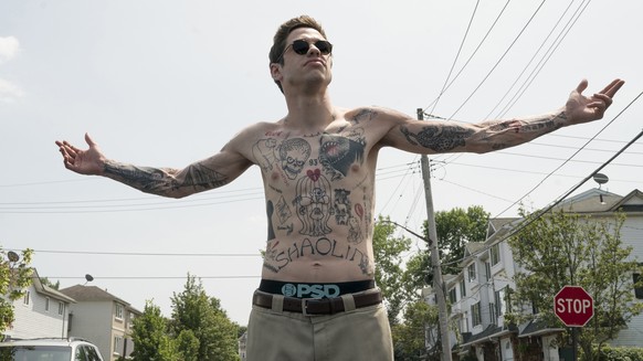In this image released by Universal Pictures, Pete Davidson appears in a scene from &quot;The King of Staten Island,&quot; directed by Judd Apatow. (Mary Cybulski/Universal Pictures via AP)