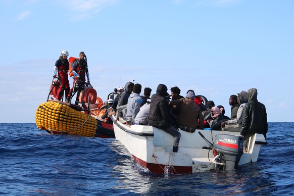 SOS Mediterranee team members from the humanitarian ship Ocean Viking approach a boat in distress with 30 people on board in the waters off Libya, Wednesday, Nov. 20, 2019. Ocean Viking, operated by D ...