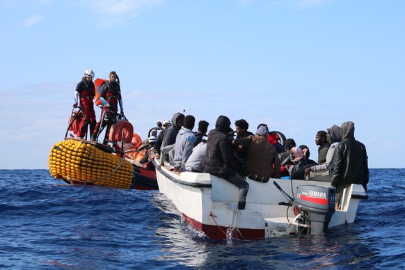 SOS Mediterranee team members from the humanitarian ship Ocean Viking approach a boat in distress with 30 people on board in the waters off Libya, Wednesday, Nov. 20, 2019. Ocean Viking, operated by D ...