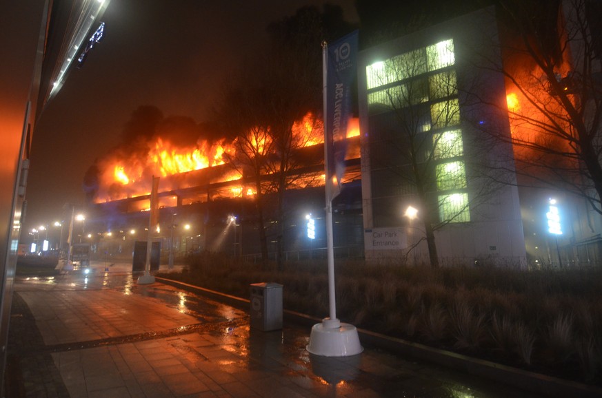 epa06412861 A handout photo made available by Britain&#039;s Merseyside Fire and Rescue showing the fire at Liverpool Echo Arena car park, in Liverpool, north west England, 31 Decemebr 2017, (issued 0 ...