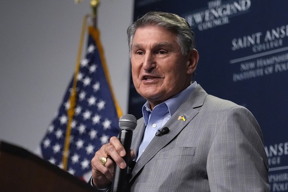 FILE - Sen. Joe Manchin, D-W.Va., stands for the Pledge of Allegiance at an event, Jan. 12, 2024, in Manchester, N.H. It&#039;s five months before the general election, and Manchin isn&#039;t running  ...