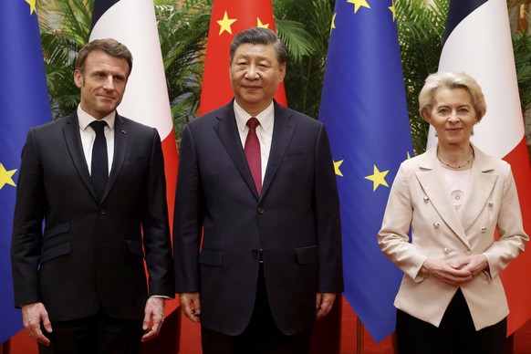 China&#039;s President Xi Jinping, center, his French counterpart Emmanuel Macron, left, and European Commission President Ursula von der Leyen meet for a working session in Beijing Thursday, April 6, ...