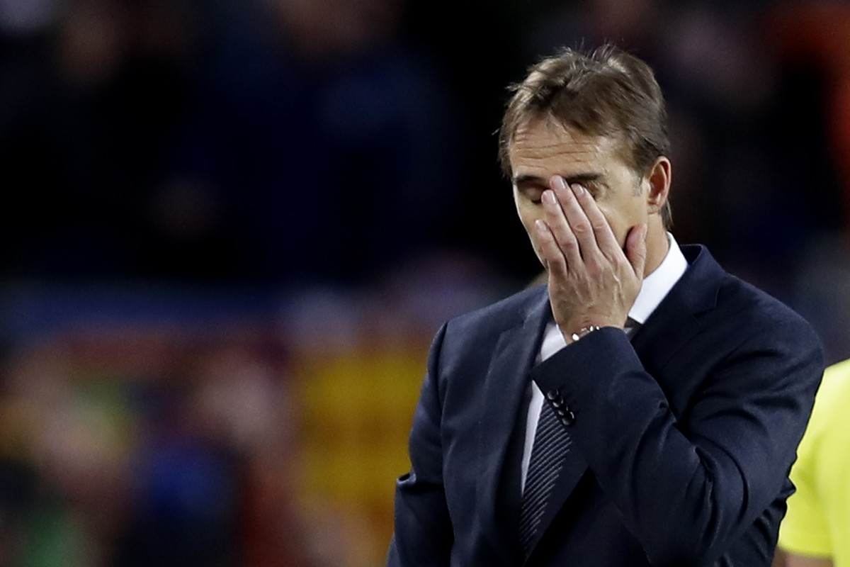 Real coach Julen Lopetegui gestures as walks off the pitch after losing 5-1 during the Spanish La Liga soccer match between FC Barcelona and Real Madrid at the Camp Nou stadium in Barcelona, Spain, Su ...