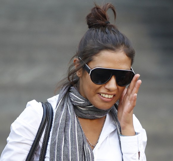 FILE - In this Monday, Oct. 3, 2011 file photo, Imane Fadil smiles as she leaves the court in Milan, Italy. Italy prosecutors have opened an investigation into the death of a Moroccan model who testif ...