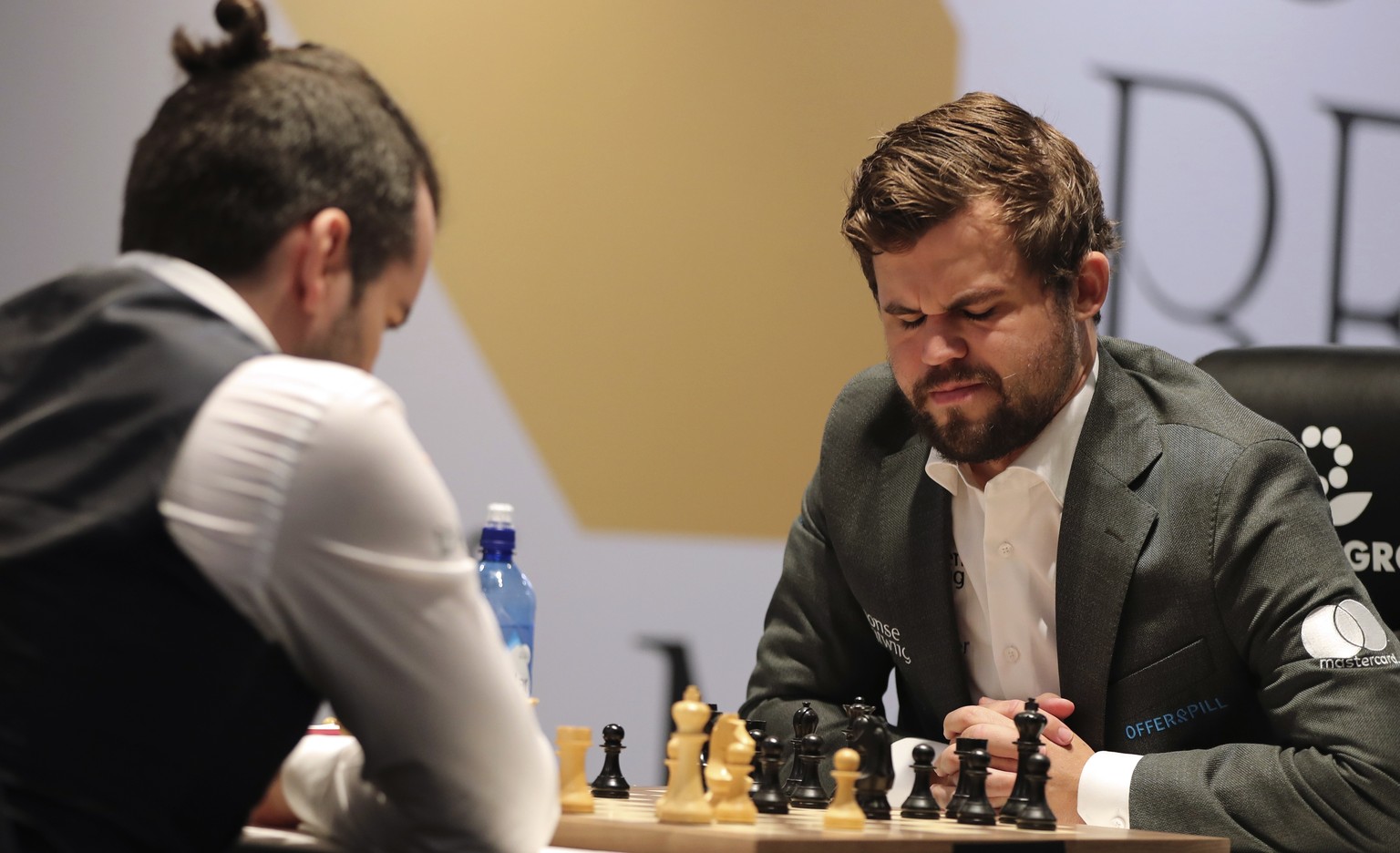 Norway&#039;s World Chess Champion Magnus Carlsen, reacts in game five against Ian Nepomniachtchi of Russia, during the FIDE World Championship at the Dubai Expo, in Dubai, United Arab Emirates, Wedne ...