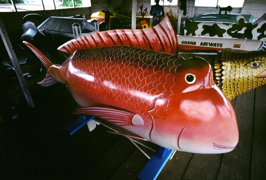 Coffin in the shape of a fish. The fantasy coffins of Teshie-Nungua. Among the Ga people, those of nobility and wealth often choose to be buried in whimsical coffins made in the form of animals and ma ...