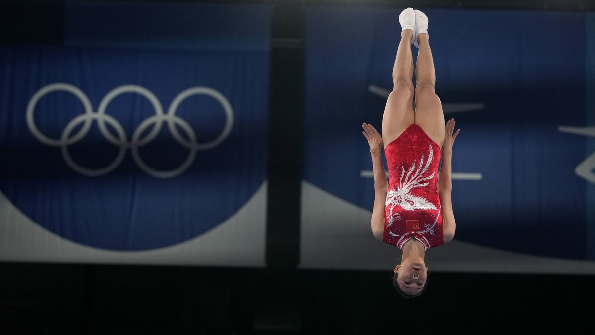 Xueying Zhu, of China, performs in a women's trampoline gymnastics qualifier at the 2020 Summer Olympics, Friday, July 30, 2021, in Tokyo. (AP Photo/Natacha Pisarenko)