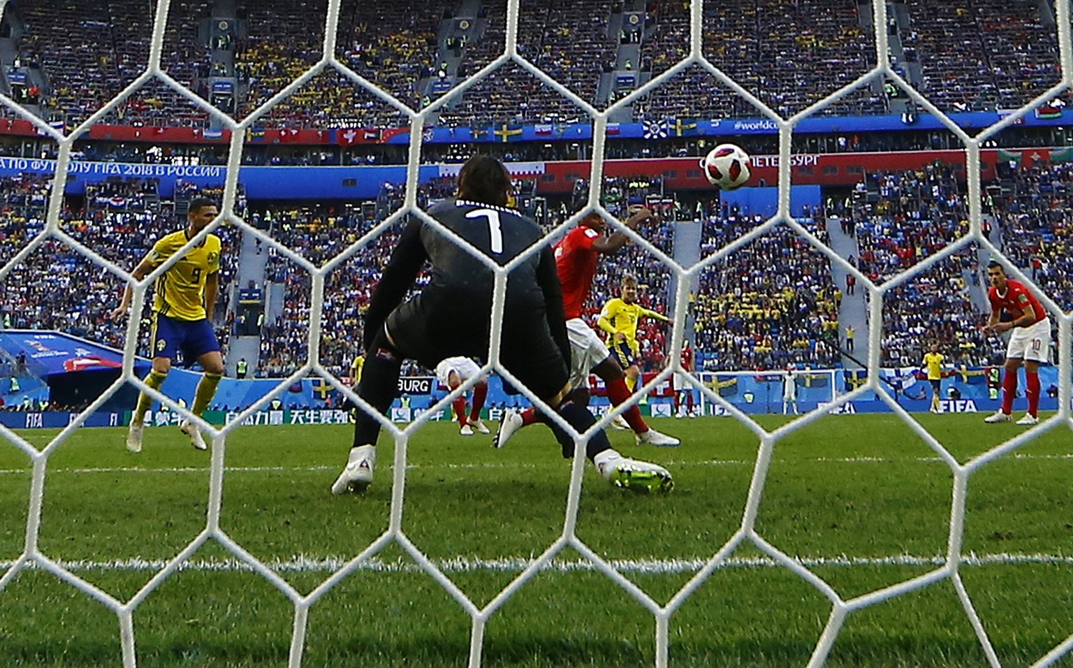 epa06861220 Manuel Akanji (C red shirt) of Switzerland deflects the shot of Emil Forsberg (C rear yellow) of Sweden to beat Swiss goalkeeper Yann Sommer as Sweden go 1-0 up during the FIFA World Cup 2 ...