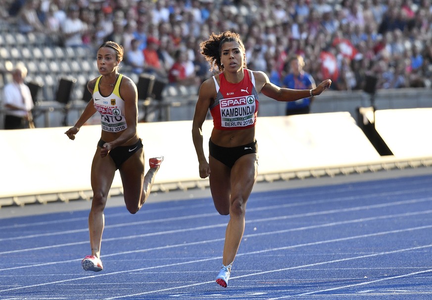 Switzerland&#039;s Mujinga Kambundji, right, and Germany&#039;s Tatjana Pinto cross the line of a women&#039;s 100-meter semifinal at the European Athletics Championships in Berlin, Germany, Tuesday,  ...