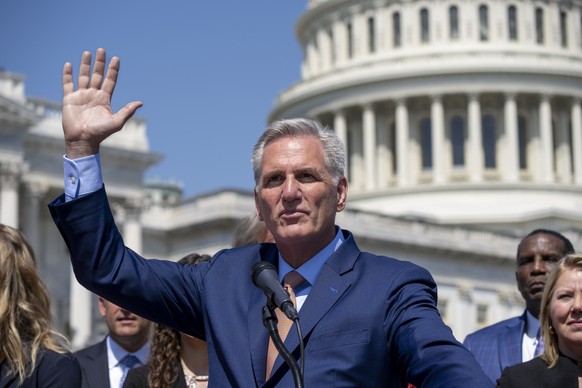 FILE - Speaker of the House Kevin McCarthy, R-Calif., waves as he and House Republicans celebrate passage in the House of a bill that would bar federally supported schools and colleges from allowing t ...