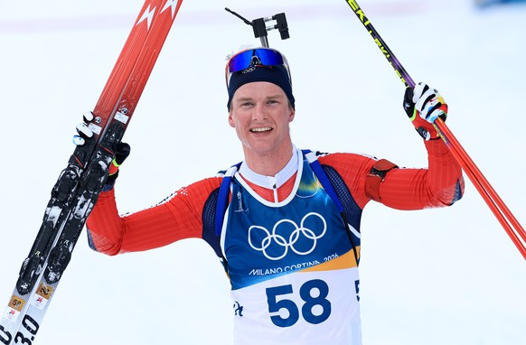 epaselect epa12723690 Johan-Olav Botn of Norway celebrates after crossing the finish line in the Men's 20km Individual of the Biathlon competitions at the Milano Cortina 2026 Winter Olympic Games ...
