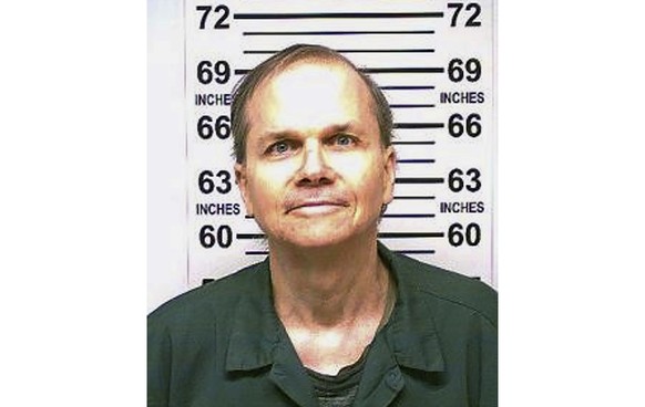 FILE - This photo provided by the New York State Department of Corrections shows Mark David Chapman, the man who shot and killed John Lennon outside his Manhattan apartment building in 1980, Jan. 31,  ...