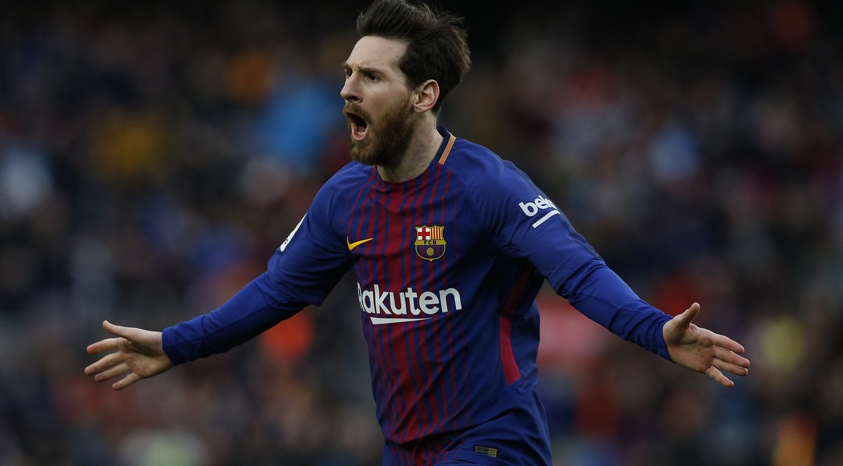 FC Barcelona's Lionel Messi reacts after scoring during the Spanish La Liga soccer match between FC Barcelona and Atletico Madrid at the Camp Nou stadium in Barcelona, Spain, Sunday, March 4, 201 ...