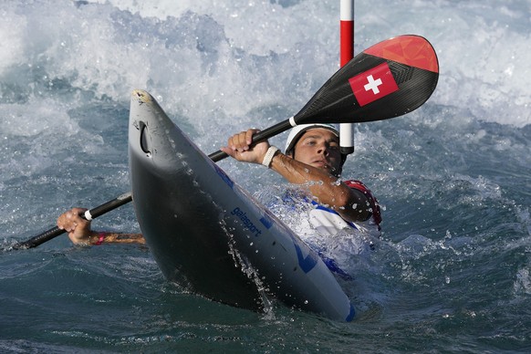 Martin Dougoud of Switzerland competes in the Men&#039;s K1 heats of the Canoe Slalom at the 2020 Summer Olympics, Wednesday, July 28, 2021, in Tokyo, Japan. (AP Photo/Kirsty Wigglesworth)
