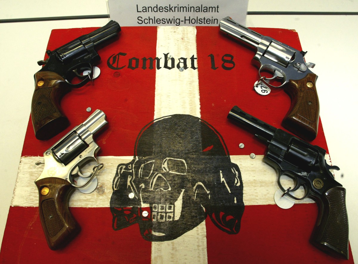 FILE - In this Tuesday, Oct. 28, 2003 file photo models of seized weapons are on display during a press conference by the state police in Kiel, northern Germany. Germany's top security official h ...