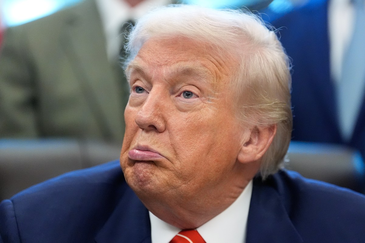 President Donald Trump reacts as he speaks to reporters after signing a spending bill that ends a partial shutdown of the federal government in the Oval Office of the White House, Tuesday, Feb. 3, 202 ...