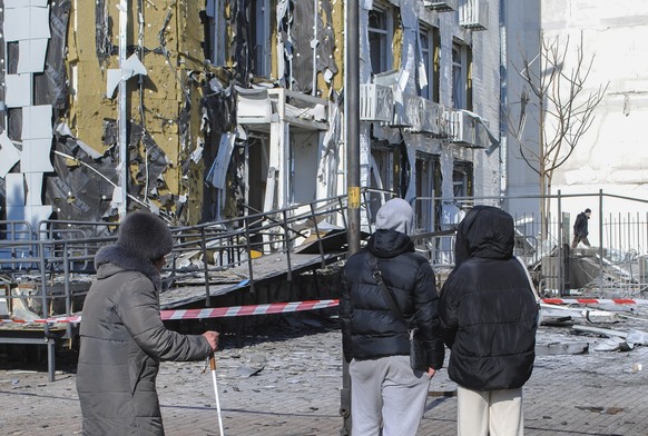 epa11907066 Local people stand near a damaged chilldren&#039;s clinic after drone strikes hit Odesa, southwestern Ukraine, 19 February 2025, amid the Russian invasion. At least four people were injure ...