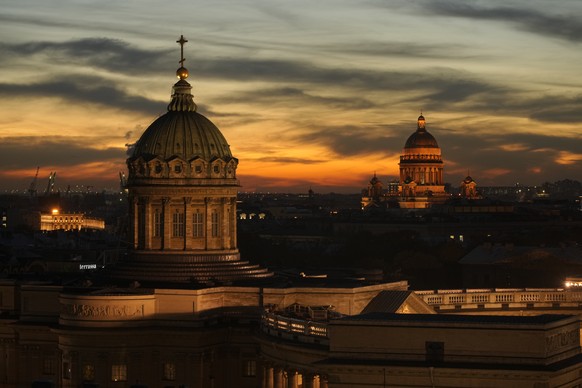 A view of Kazansky, left, and St. Isaac&#039;s Cathedrals at sunset in central St. Petersburg, Russia, Saturday, Oct. 21, 2023. (AP Photo/Dmitri Lovetsky)