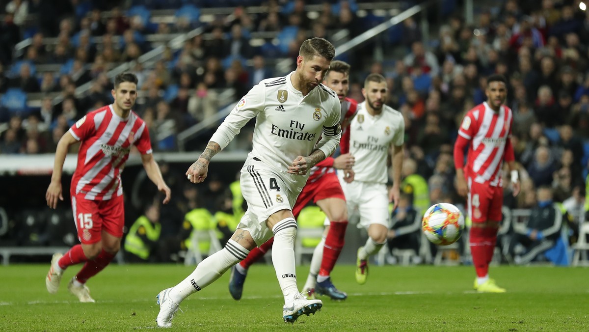 Real Madrid's Sergio Ramos kicks the ball to score a penalty during a Spanish Copa del Rey soccer match between Real Madrid and Girona at the Bernabeu stadium in Madrid, Spain, Thursday, Jan. 24, ...