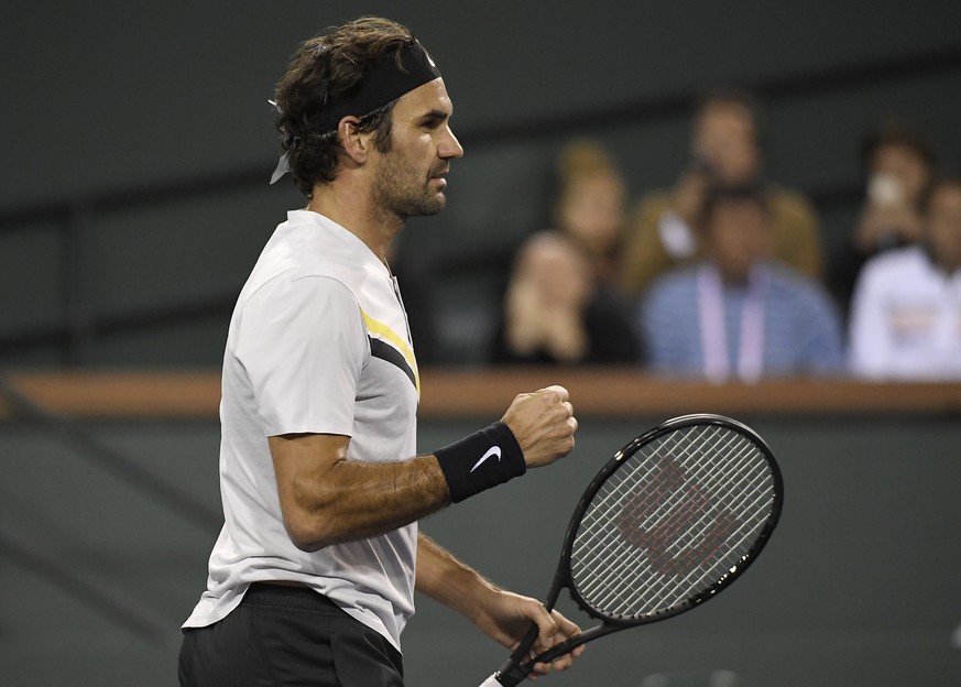 Roger Federer, of Switzerland, clenches his fist after defeating Chung Hyeon, of South Korea, during the quarterfinals at the BNP Paribas Open tennis tournament Thursday, March 15, 2018, in Indian Wel ...